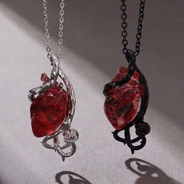 heart couple necklace with exaggerated design, thorns, vines, flowers, clavicle chain, Halloween pendant